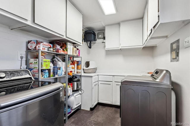 washroom with washer and dryer and cabinet space