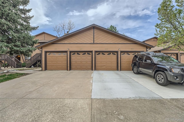garage with concrete driveway