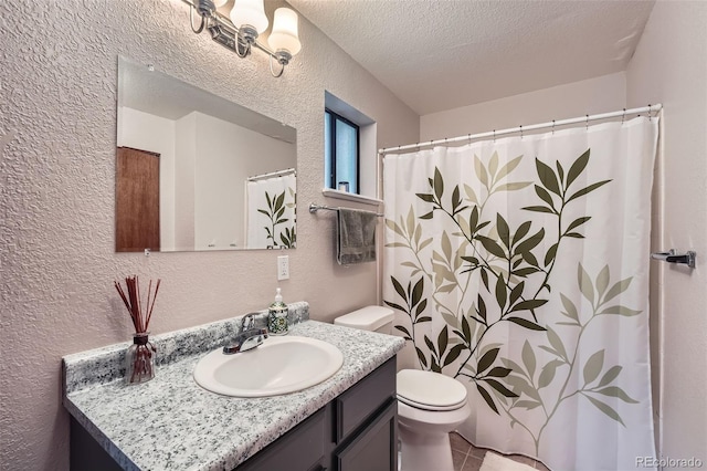 full bath featuring a textured wall, toilet, vanity, a textured ceiling, and tile patterned flooring