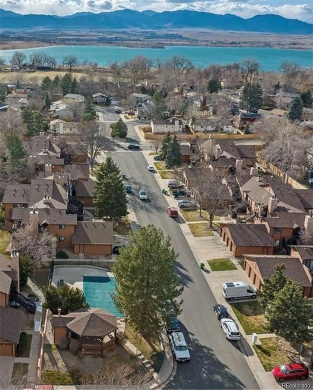 aerial view featuring a residential view and a water and mountain view