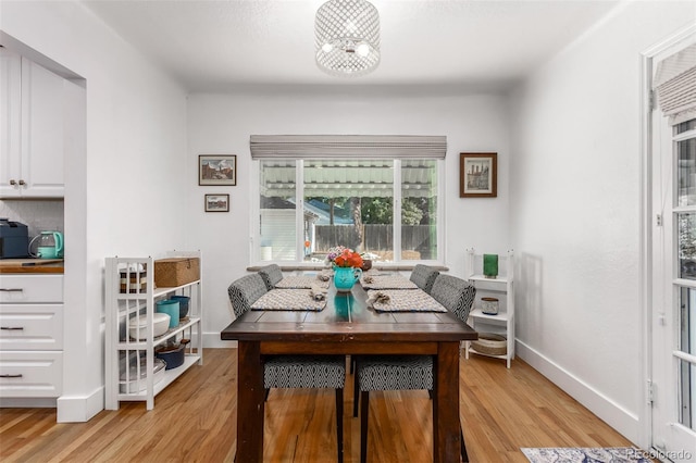 dining space featuring light hardwood / wood-style floors