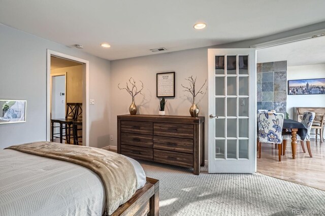 bedroom with carpet, recessed lighting, and visible vents