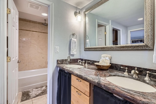 full bathroom with a combined bath / shower with rainfall shower, visible vents, a sink, and tile patterned flooring
