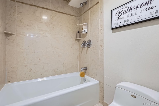 bathroom featuring toilet and shower / tub combination