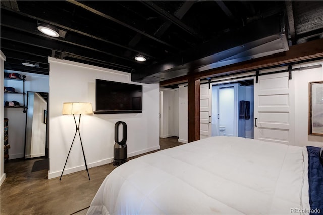 1172 Harrison St, Denver, CO 80206 - bedroom featuring baseboards, finished concrete floors, and a barn door