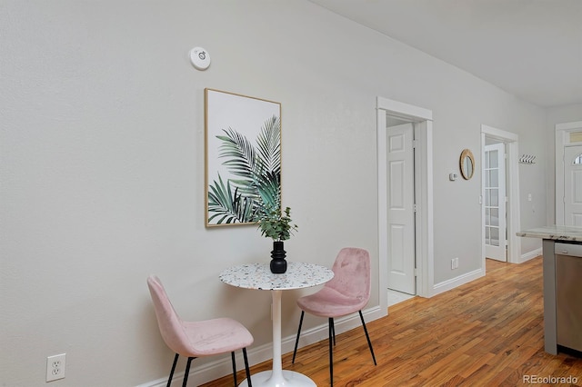 2424 N Clay St, Denver, CO 80211 - dining area with baseboards and light wood-type flooring