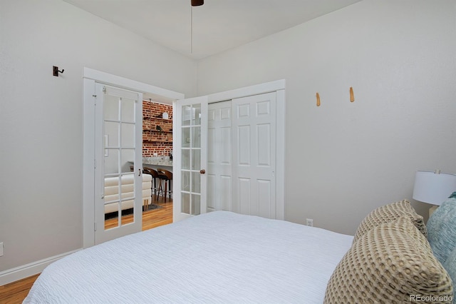2424 N Clay St, Denver, CO 80211 - bedroom featuring wood finished floors, a closet, baseboards, and a ceiling fan