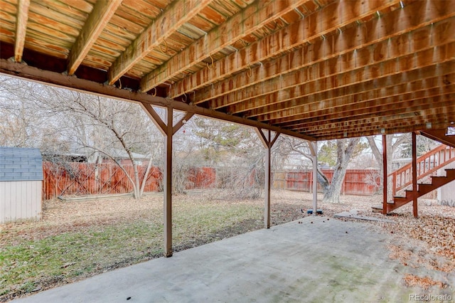 view of patio featuring a shed