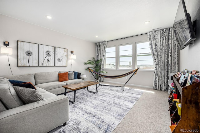 living area featuring carpet floors, recessed lighting, baseboards, and visible vents