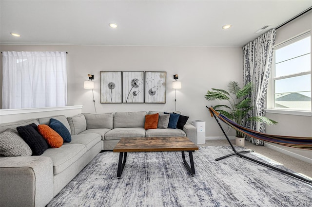 living room featuring recessed lighting, baseboards, visible vents, and carpet