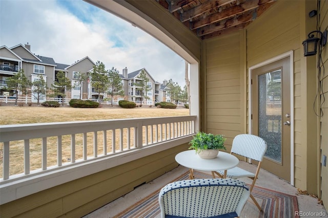 balcony with a residential view and covered porch