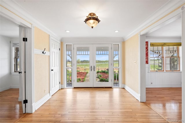 6231 Prospect Rd, Longmont, CO 80503 - foyer with light wood-style floors, french doors, crown molding, baseboards, and recessed lighting
