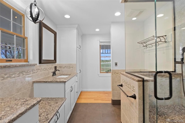 6231 Prospect Rd, Longmont, CO 80503 - bathroom with tile patterned floors, vanity, a shower stall, recessed lighting, and baseboards
