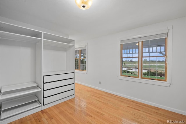 6231 Prospect Rd, Longmont, CO 80503 - unfurnished bedroom with baseboards and wood finished floors