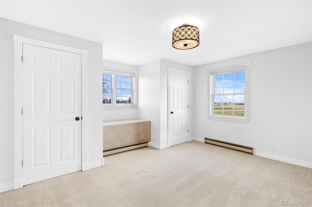 6231 Prospect Rd, Longmont, CO 80503 - unfurnished bedroom with baseboard heating, a baseboard radiator, baseboards, and carpet flooring