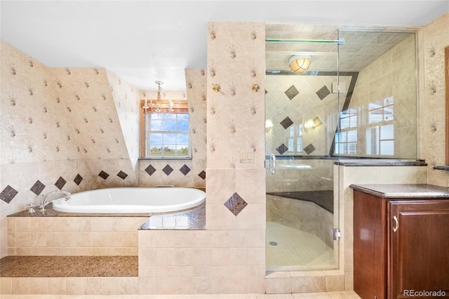 6231 Prospect Rd, Longmont, CO 80503 - full bathroom featuring a shower stall, a garden tub, tile walls, and a chandelier