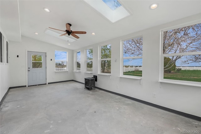 6231 Prospect Rd, Longmont, CO 80503 - unfurnished sunroom with a wood stove, a skylight, and lofted ceiling