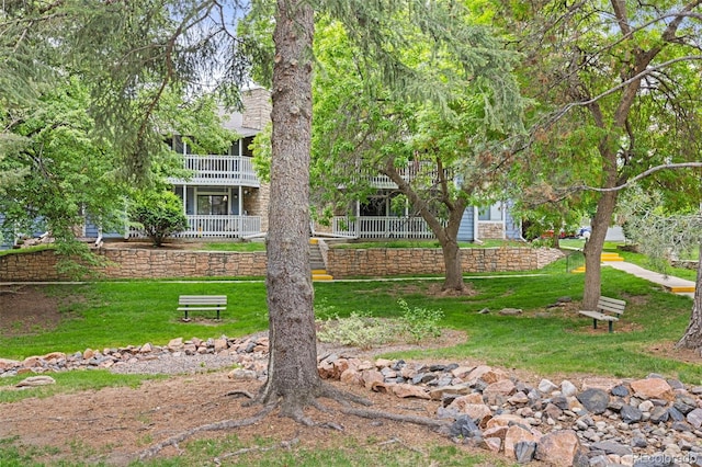 8335 Fairmount Dr Unit 208, Denver, CO 80247 - back of house with a lawn and a balcony