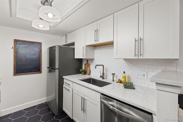 8335 Fairmount Dr Unit 208, Denver, CO 80247 - kitchen with appliances with stainless steel finishes, tasteful backsplash, white cabinetry, and light stone counters