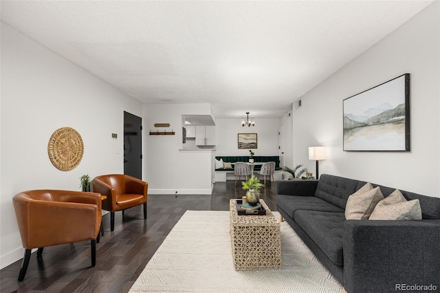 8335 Fairmount Dr Unit 208, Denver, CO 80247 - living room featuring dark wood-type flooring and a chandelier