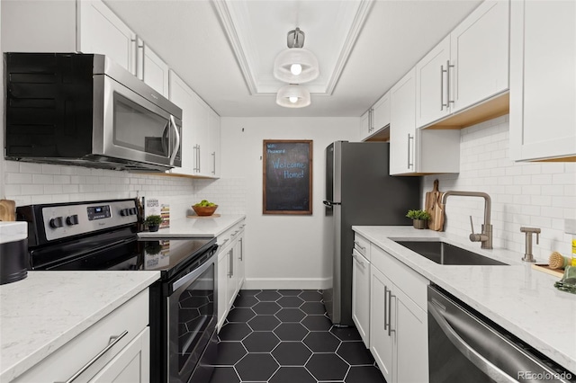 8335 Fairmount Dr Unit 208, Denver, CO 80247 - kitchen with stainless steel appliances, white cabinetry, dark tile patterned flooring, backsplash, and light stone counters