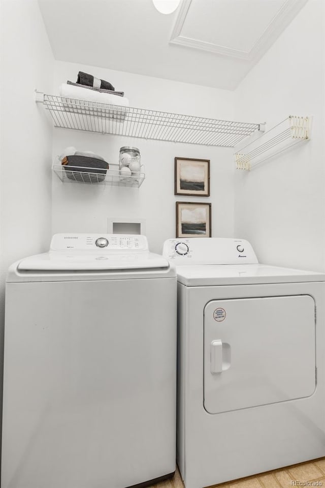 8335 Fairmount Dr Unit 208, Denver, CO 80247 - washroom featuring washing machine and dryer and attic access