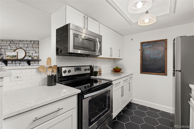 8335 Fairmount Dr Unit 208, Denver, CO 80247 - kitchen featuring appliances with stainless steel finishes, white cabinetry, backsplash, and a textured ceiling