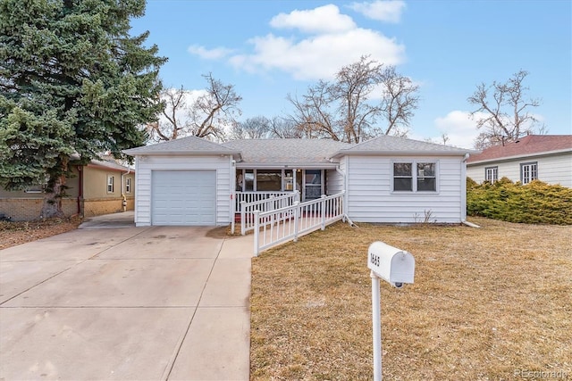 ranch-style house featuring a front yard, covered porch, an attached garage, and concrete driveway