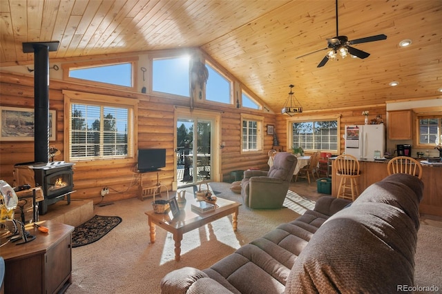 living room with log walls, high vaulted ceiling, a wood stove, and wooden ceiling