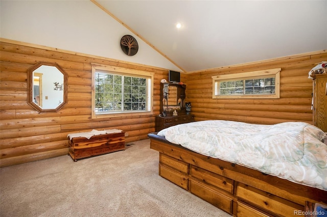 carpeted bedroom with high vaulted ceiling and log walls