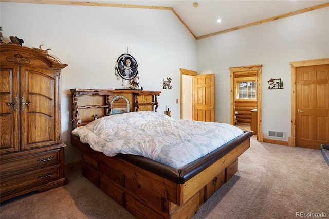 bedroom featuring carpet floors and high vaulted ceiling