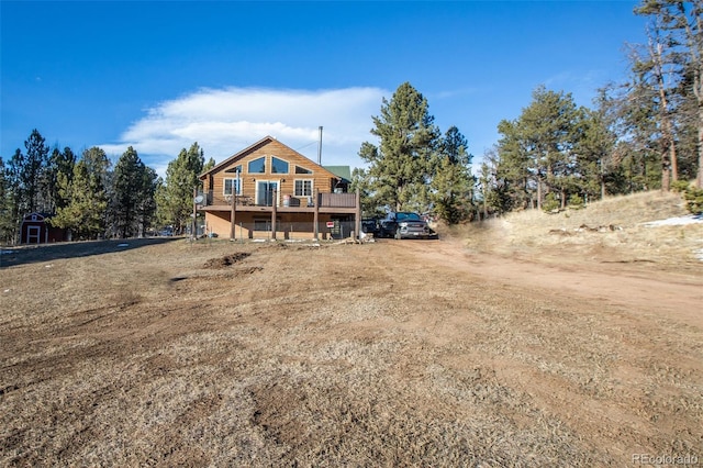 back of property featuring a deck