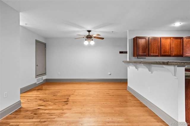 3211 Zuni St Unit 14, Denver, CO 80211 - unfurnished living room with ceiling fan, light wood-type flooring, and baseboards