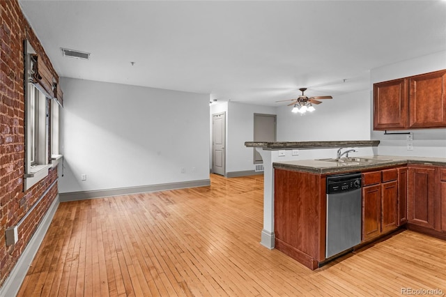 3211 Zuni St Unit 14, Denver, CO 80211 - kitchen featuring stainless steel dishwasher, a sink, brick wall, light wood-type flooring, and ceiling fan