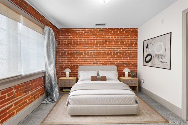 3211 Zuni St Unit 14, Denver, CO 80211 - carpeted bedroom featuring brick wall