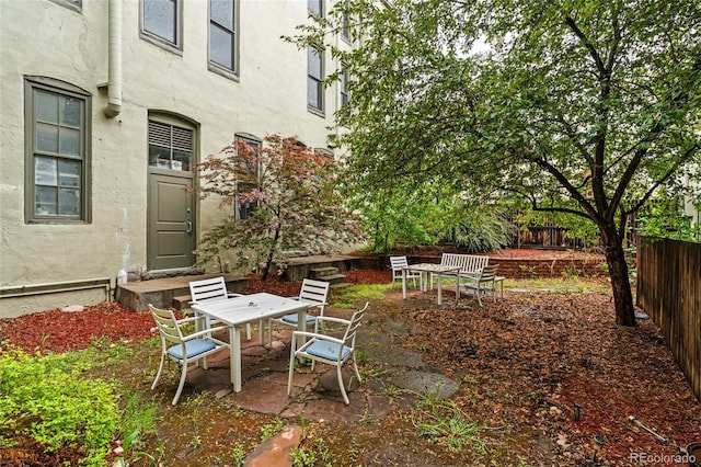 3211 Zuni St Unit 14, Denver, CO 80211 - view of patio / terrace featuring fence and outdoor dining space
