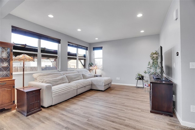 living room with light hardwood / wood-style flooring