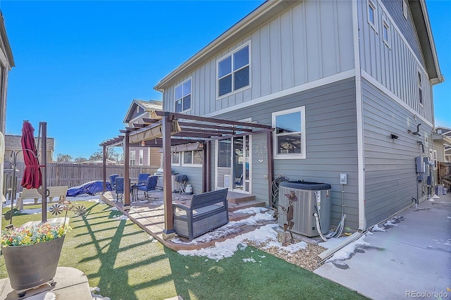 rear view of house featuring a yard, cooling unit, a patio area, and a pergola