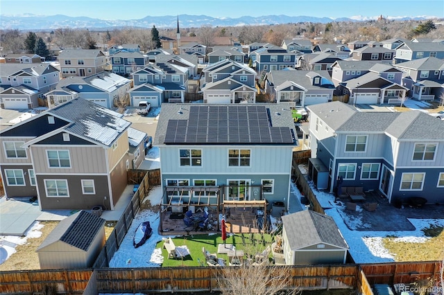drone / aerial view featuring a mountain view and a residential view