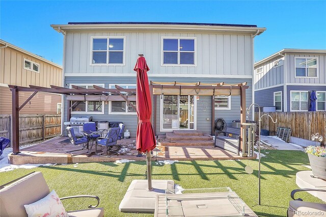 rear view of house featuring a patio, a fenced backyard, a lawn, and a pergola