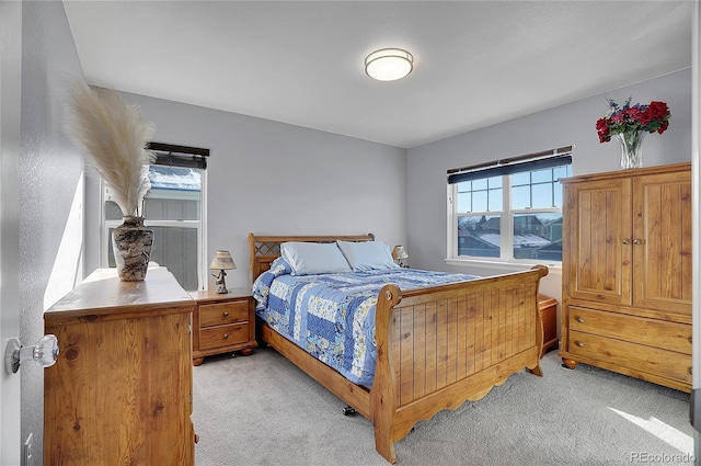 bedroom with light colored carpet