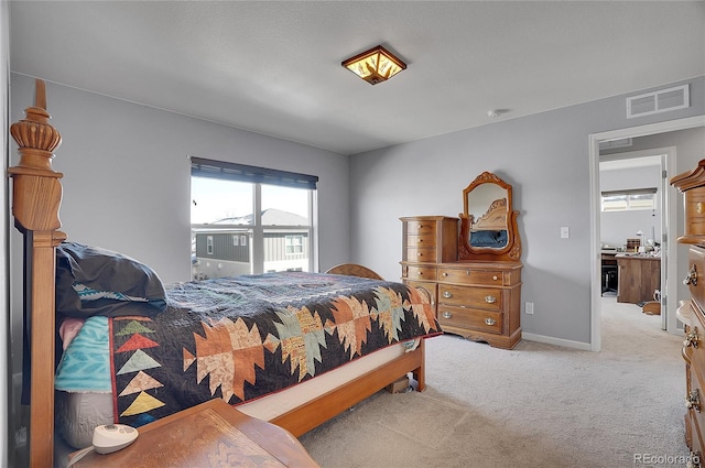 bedroom featuring carpet floors, baseboards, and visible vents