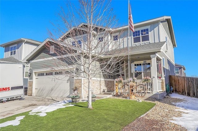 craftsman house featuring an attached garage, fence, board and batten siding, concrete driveway, and a porch
