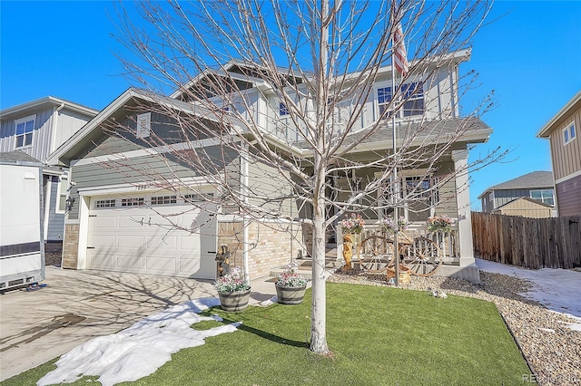 view of front of home featuring driveway, fence, covered porch, a garage, and a front lawn