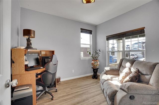 office with baseboards and wood finished floors