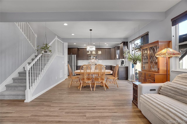 7888 Tejon St, Denver, CO 80221 - dining space with stairway, light wood finished floors, healthy amount of natural light, recessed lighting, and baseboards