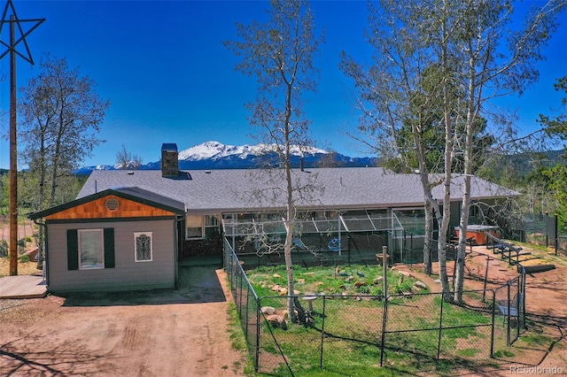 view of front facade with a mountain view and an outdoor structure