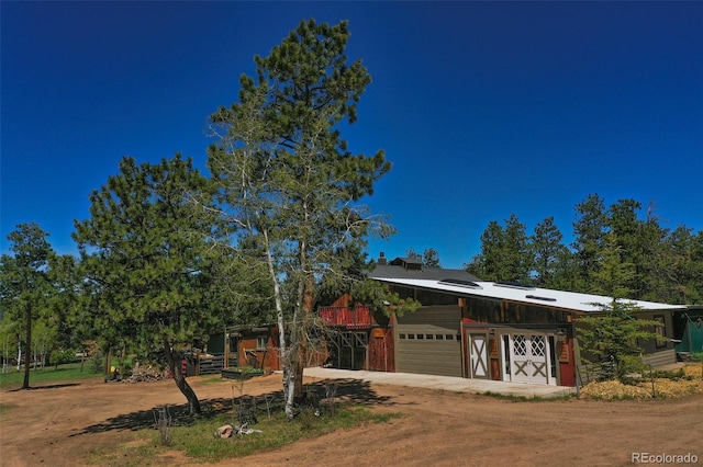 view of front of home with an outbuilding