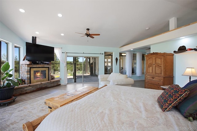 bedroom with ceiling fan, light hardwood / wood-style floors, lofted ceiling, and access to outside