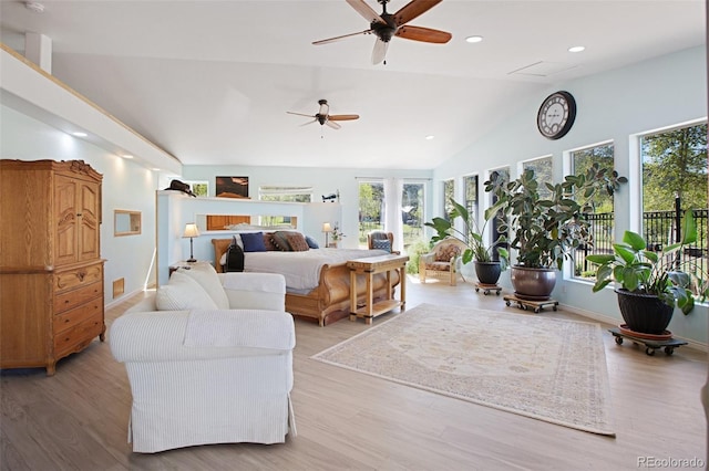 bedroom featuring light hardwood / wood-style floors and vaulted ceiling